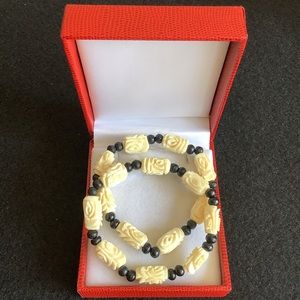 Two Hand carved bone stretch bracelets.